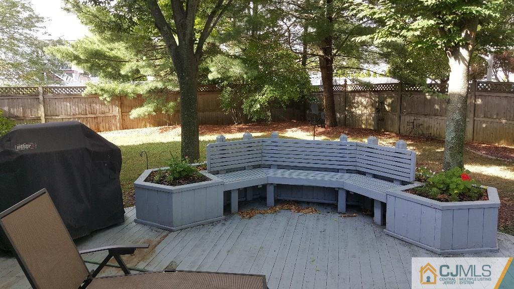 53 Higgins Road Old Bridge, NJ 08857 - Photo 14 of 17 a view of backyard with deck and outdoor seating