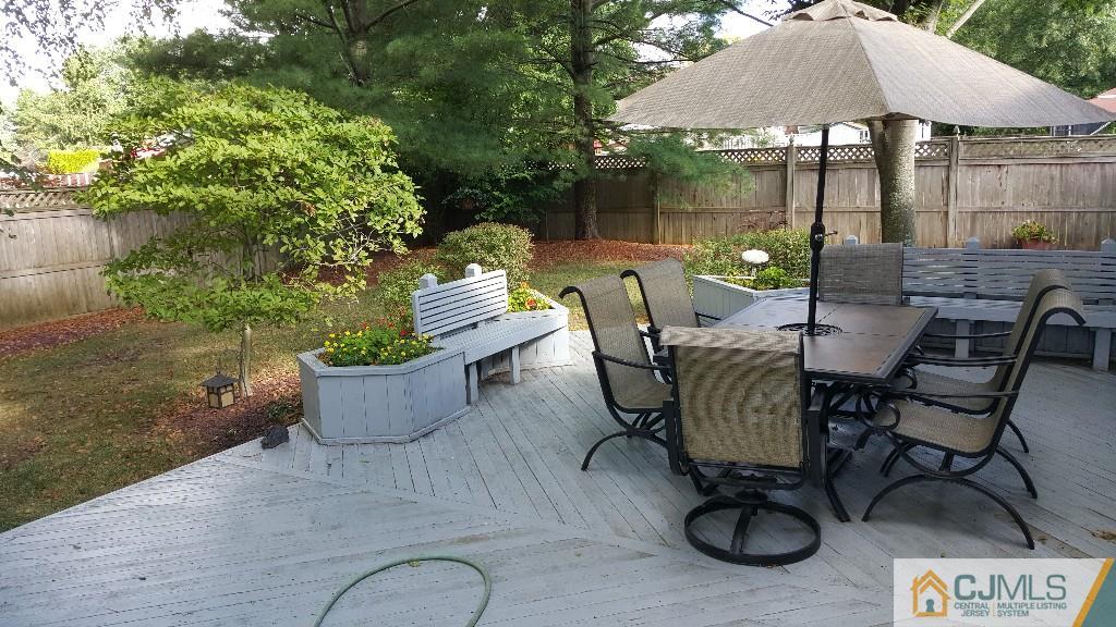 53 Higgins Road Old Bridge, NJ 08857 - Photo 15 of 17 a view of a chairs and table in backyard