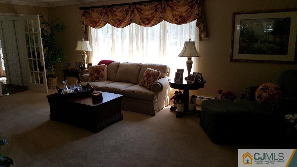 53 Higgins Road Old Bridge, NJ 08857 - Photo 4 of 17 a living room with furniture and a window