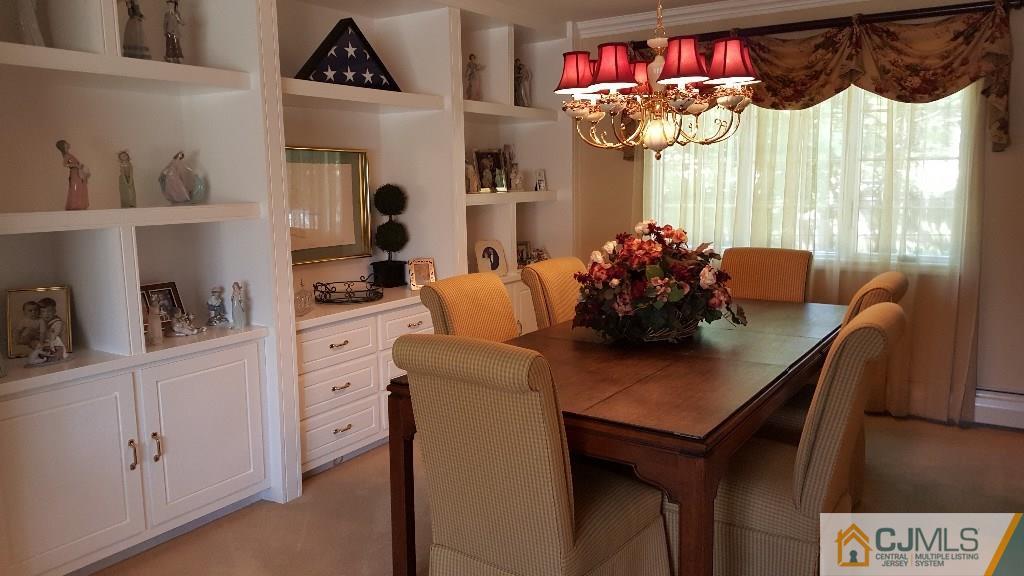 53 Higgins Road Old Bridge, NJ 08857 - Photo 5 of 17 a view of a dining room with furniture and a window