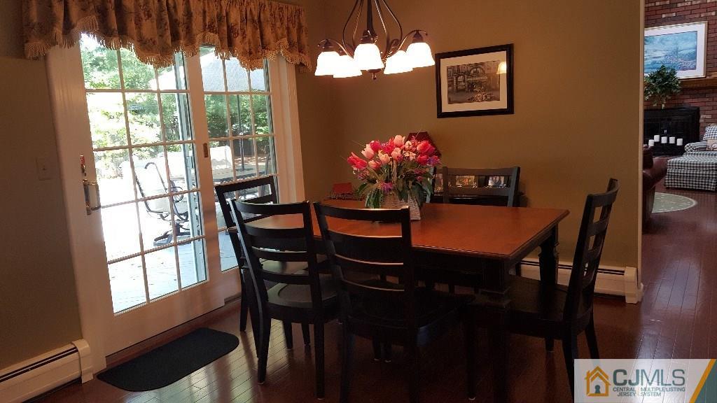53 Higgins Road Old Bridge, NJ 08857 - Photo 8 of 17 a view of a dining room with furniture window and wooden floor