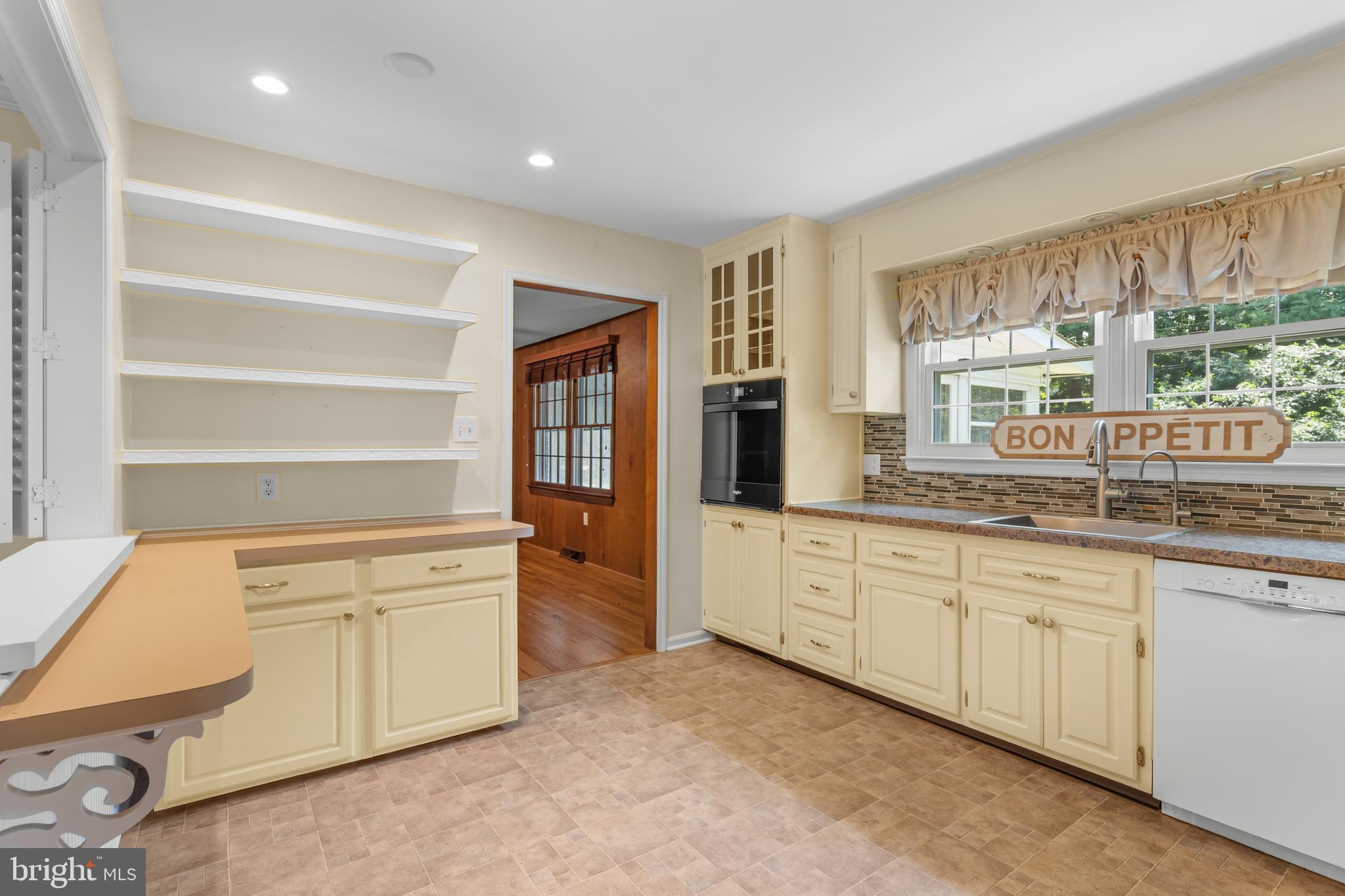 10 Cohee Circle Wilmington, DE 19803 - Photo 6 of 30 a open kitchen with granite countertop a sink and white cabinets with wooden floor