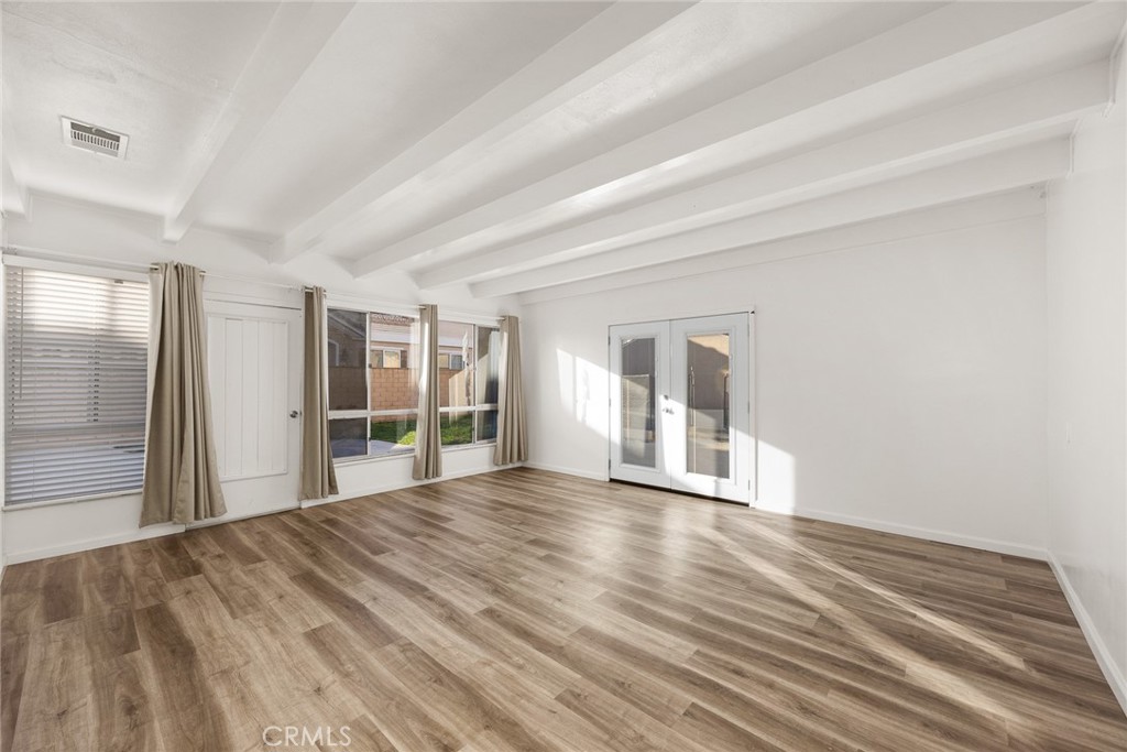 141 Fano Street Arcadia, CA 91006 - Photo 12 of 22 a view of an empty room with wooden floor and a window