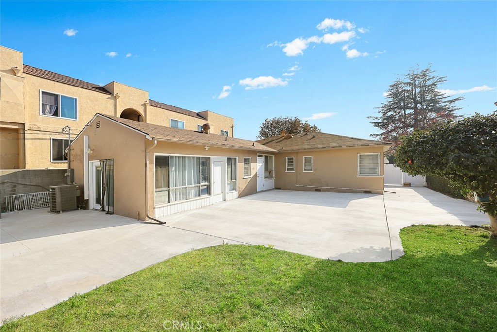 141 Fano Street Arcadia, CA 91006 - Photo 15 of 22 a front view of a house with a garden and yard