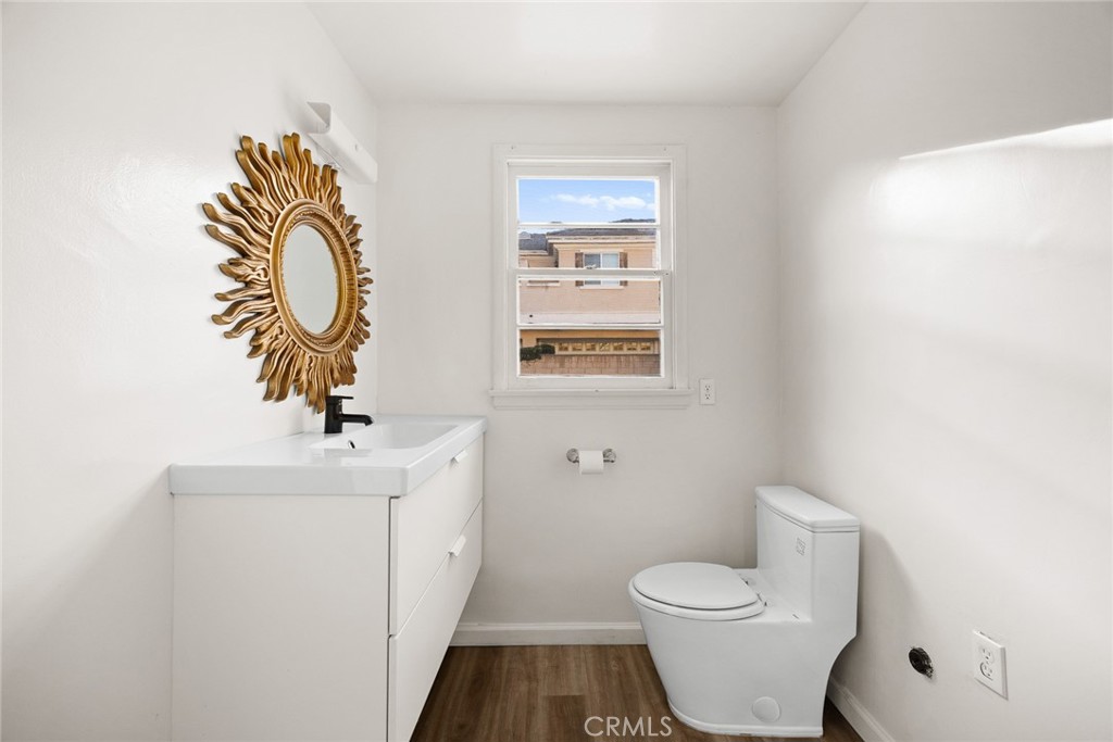 141 Fano Street Arcadia, CA 91006 - Photo 8 of 22 a bathroom with a toilet a sink and mirror