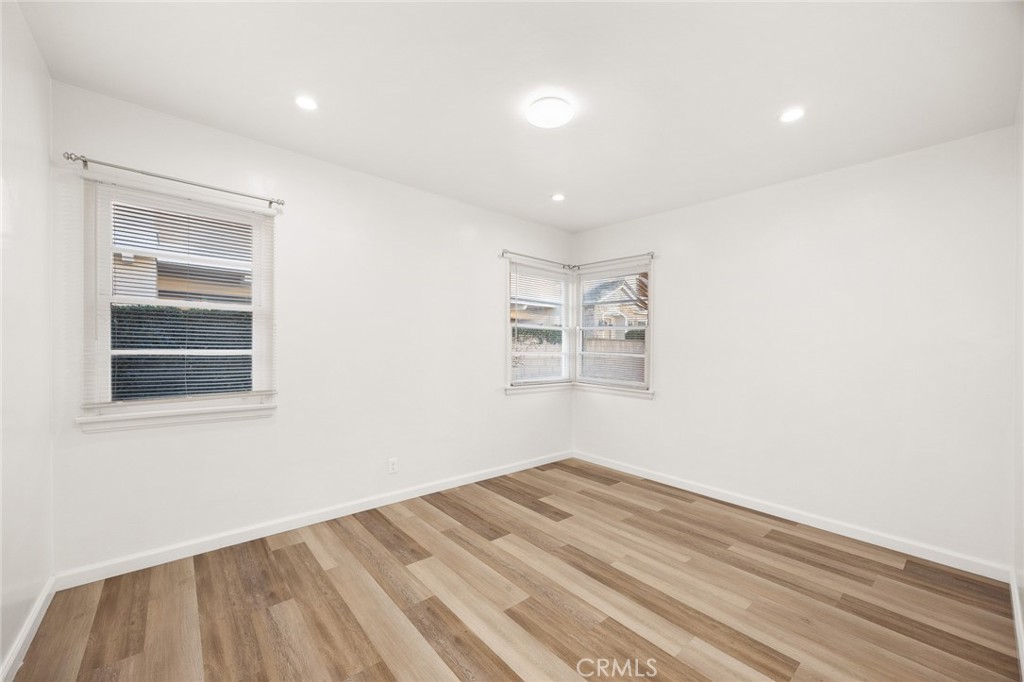 141 Fano Street Arcadia, CA 91006 - Photo 9 of 22 a view of empty room with wooden floor and fan