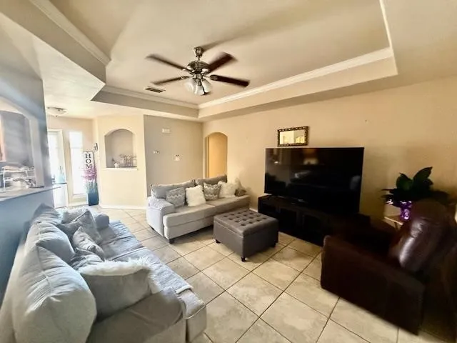 a living room with furniture and a lamp