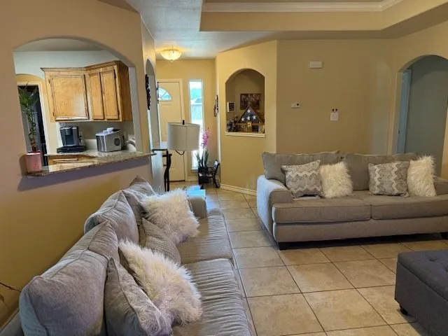 a living room with furniture and a couch