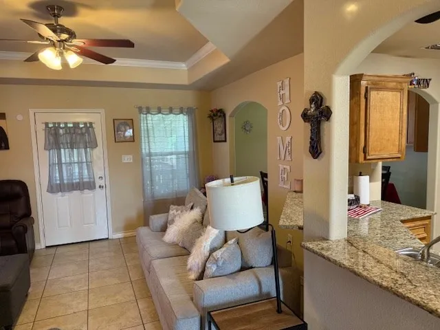 a living room with furniture and a rug