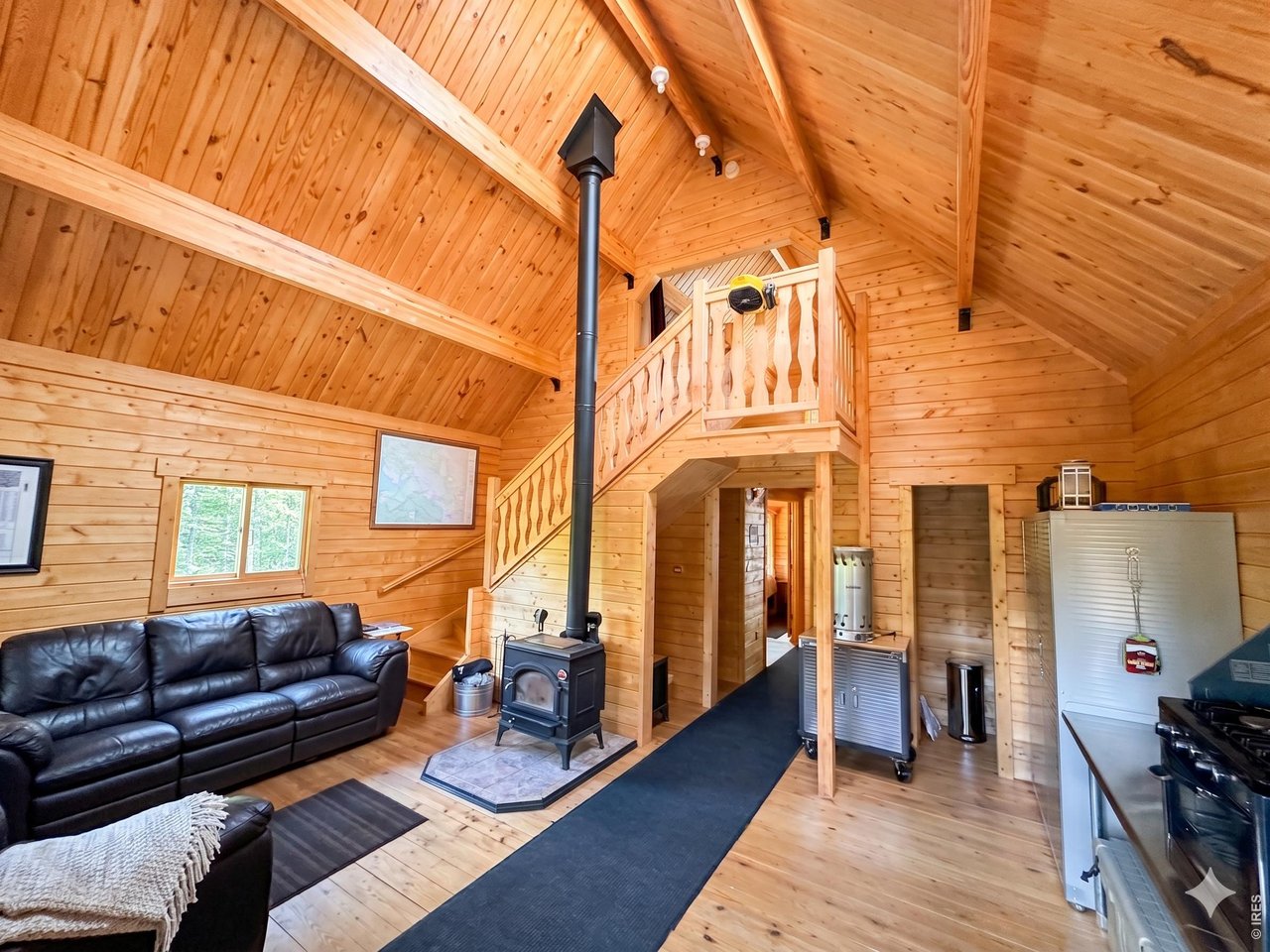 10000 Forest Road, Unit 169 Red Feather Lakes, CO 80545 - Photo 4 of 31 The great room invites you in to a fantastic space with vaulted ceilings and useful amenities. AI Enhanced images.