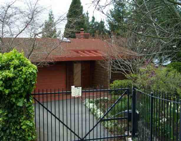 a view of a house with a small yard