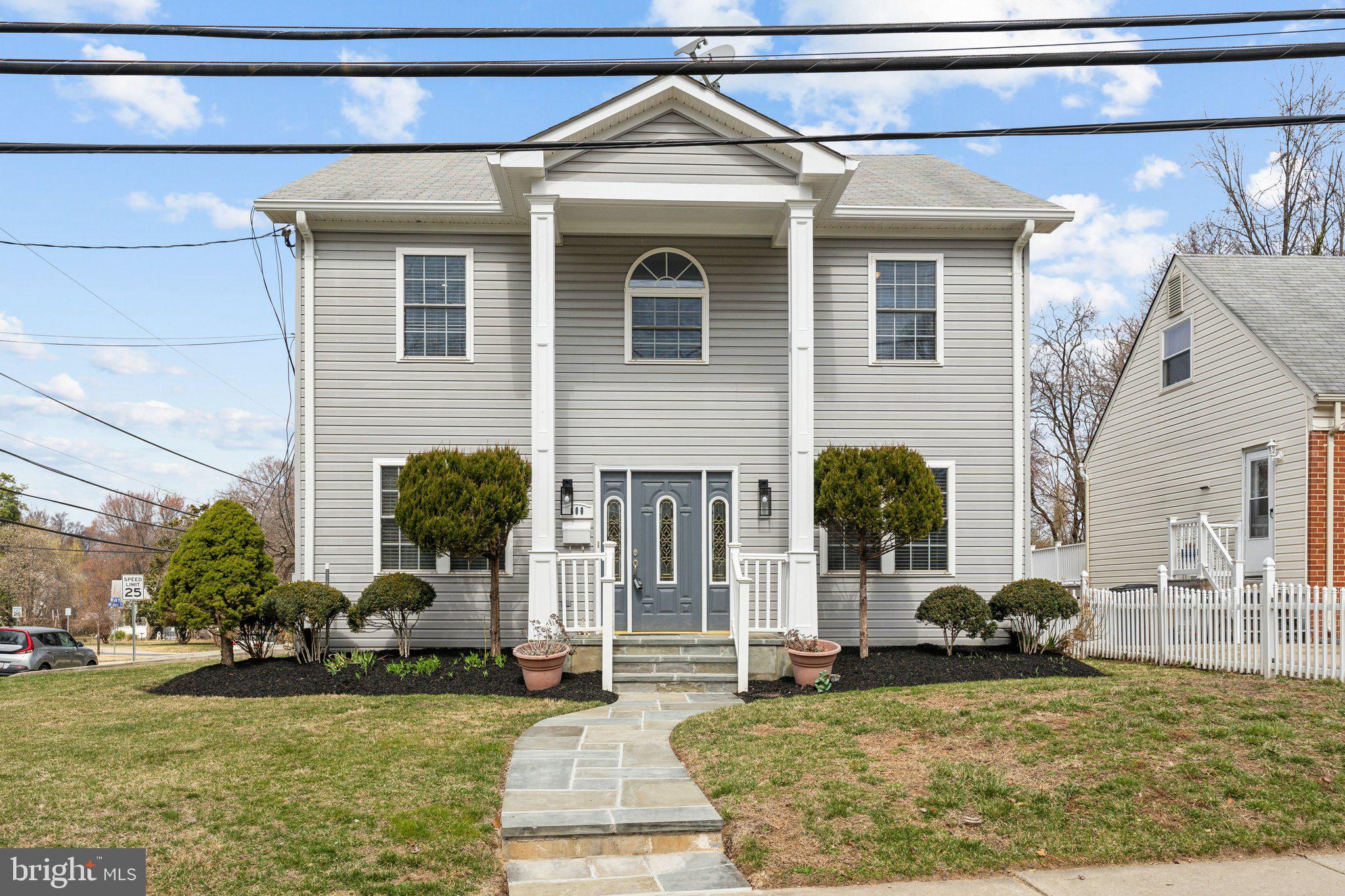 a front view of a house with garden