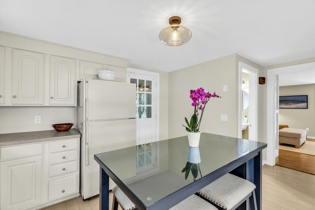 665 Route 6A Sandwich, MA 02537 - Photo 13 of 42 a view of kitchen with cabinets table and chair