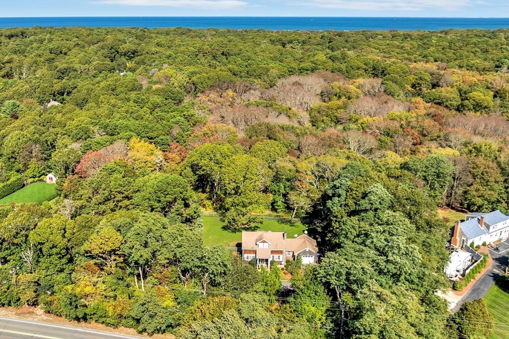 665 Route 6A Sandwich, MA 02537 - Photo 39 of 42 a view of a big yard with lots of bushes