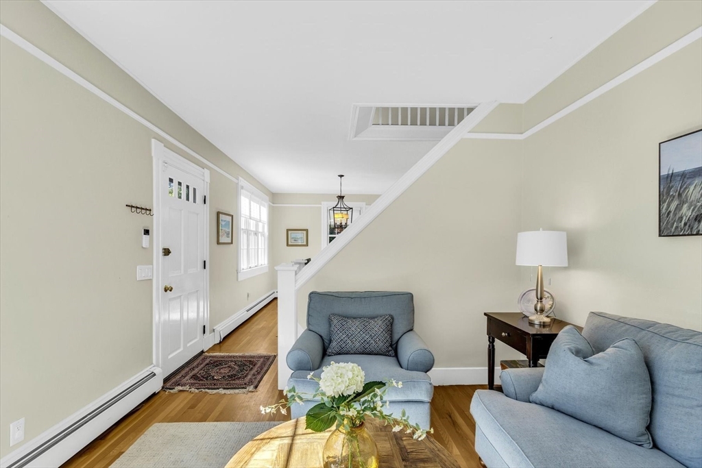 665 Route 6A Sandwich, MA 02537 - Photo 8 of 42 a living room with furniture and a rug