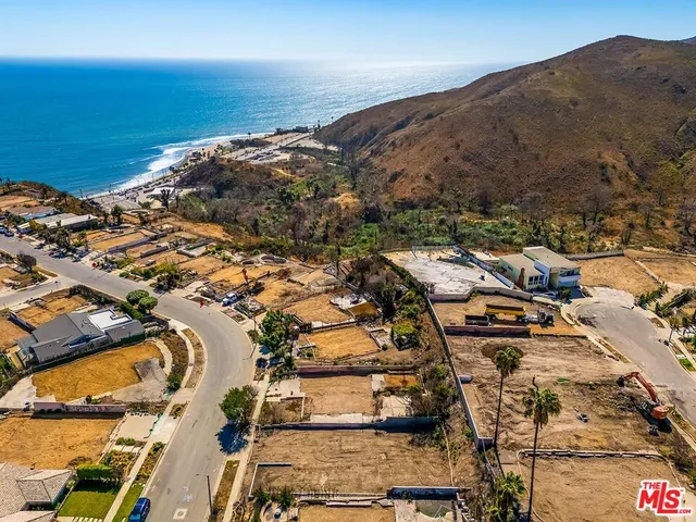 an aerial view of residential building and ocean