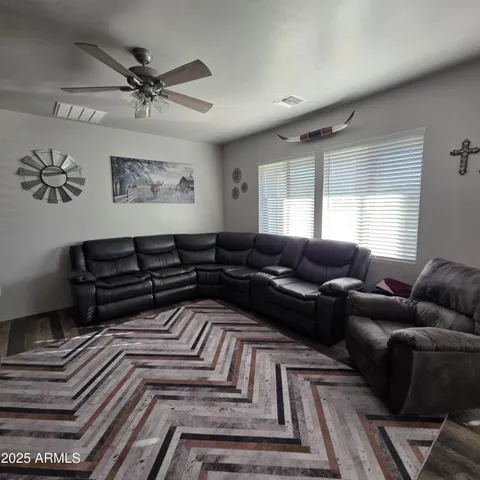 a living room with furniture and a rug