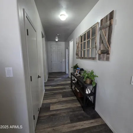 a view of entryway with wooden floor