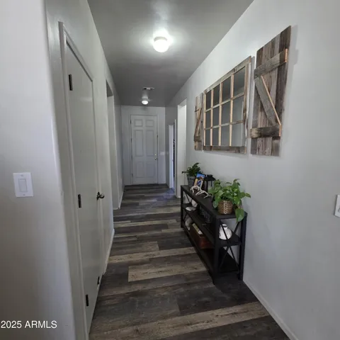 a view of entryway with wooden floor