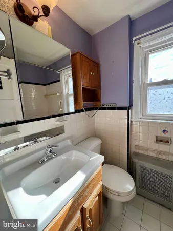 a bathroom with a sink and toilet