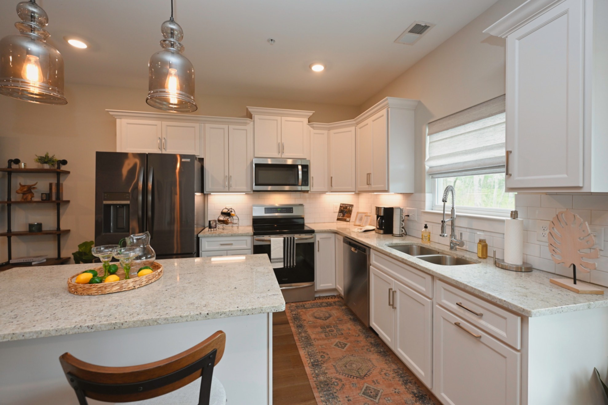 1144 Lock 4 Road, Unit J4 Gallatin, TN 37066 - Photo 11 of 39 a kitchen with a sink a counter space appliances and cabinets