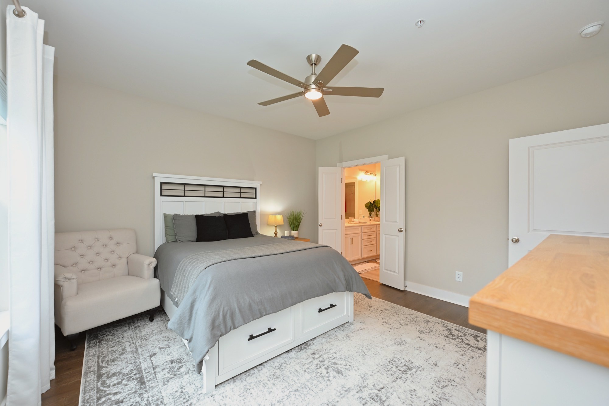 1144 Lock 4 Road, Unit J4 Gallatin, TN 37066 - Photo 17 of 39 a bedroom with a bed and a chandelier