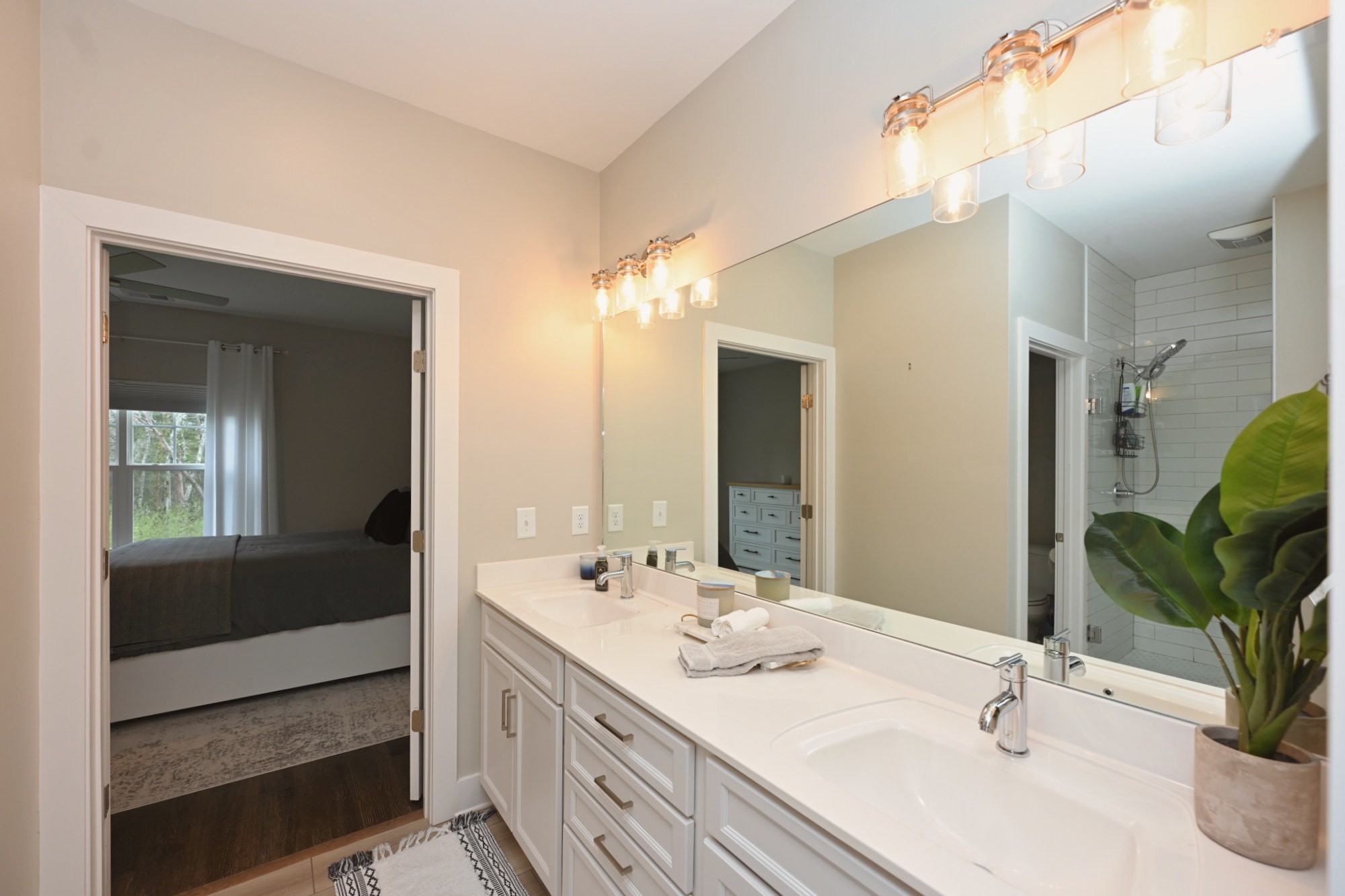 1144 Lock 4 Road, Unit J4 Gallatin, TN 37066 - Photo 20 of 39 a bathroom with double vanity sink and a mirror