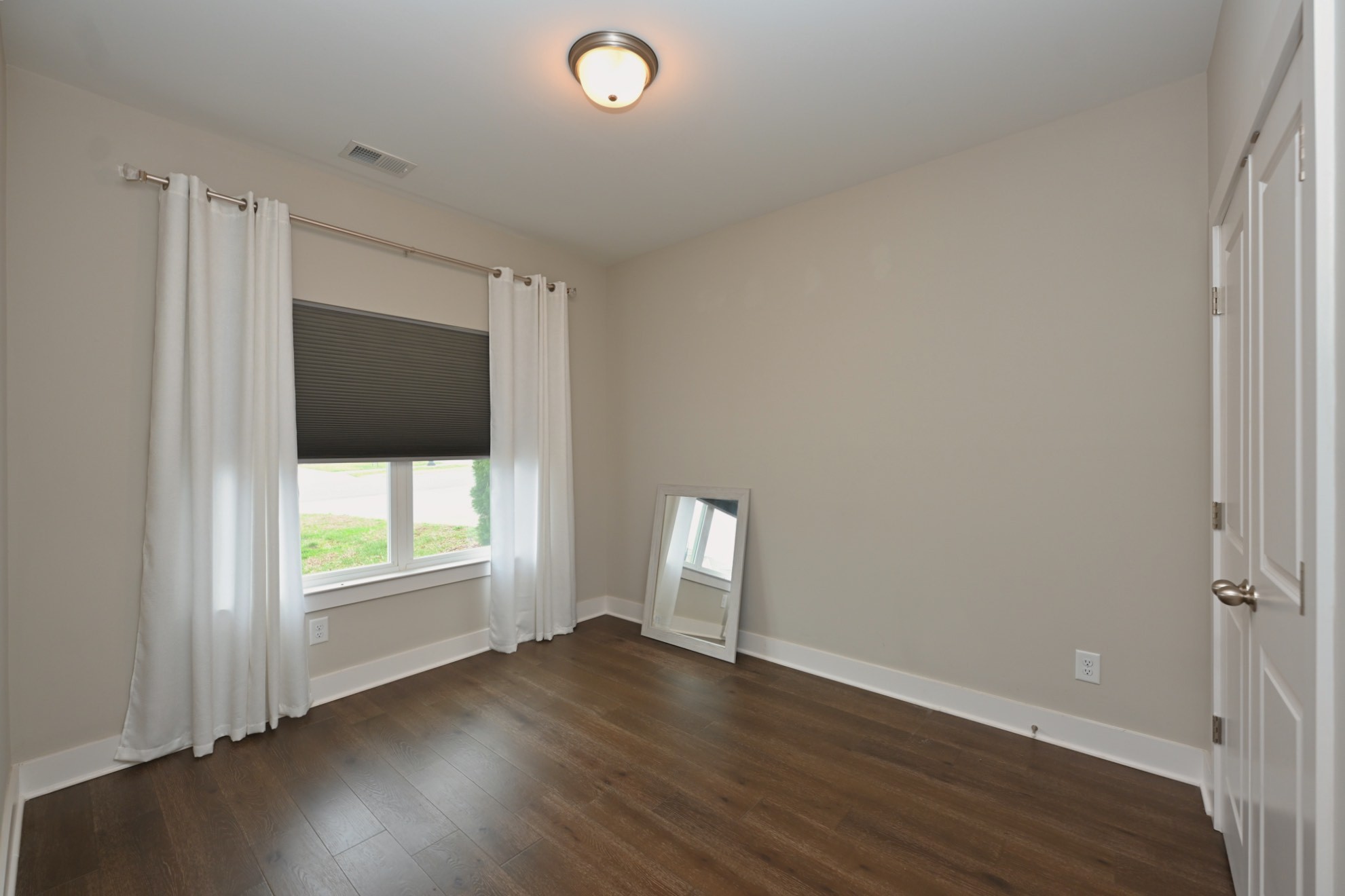 1144 Lock 4 Road, Unit J4 Gallatin, TN 37066 - Photo 25 of 39 an empty room with wooden floor and windows