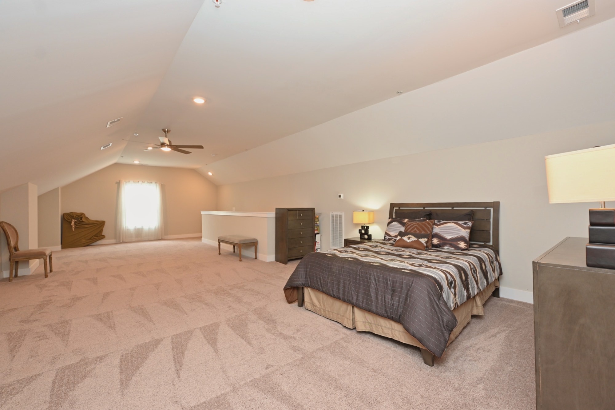 1144 Lock 4 Road, Unit J4 Gallatin, TN 37066 - Photo 30 of 39 a bedroom with a large bed and a large window