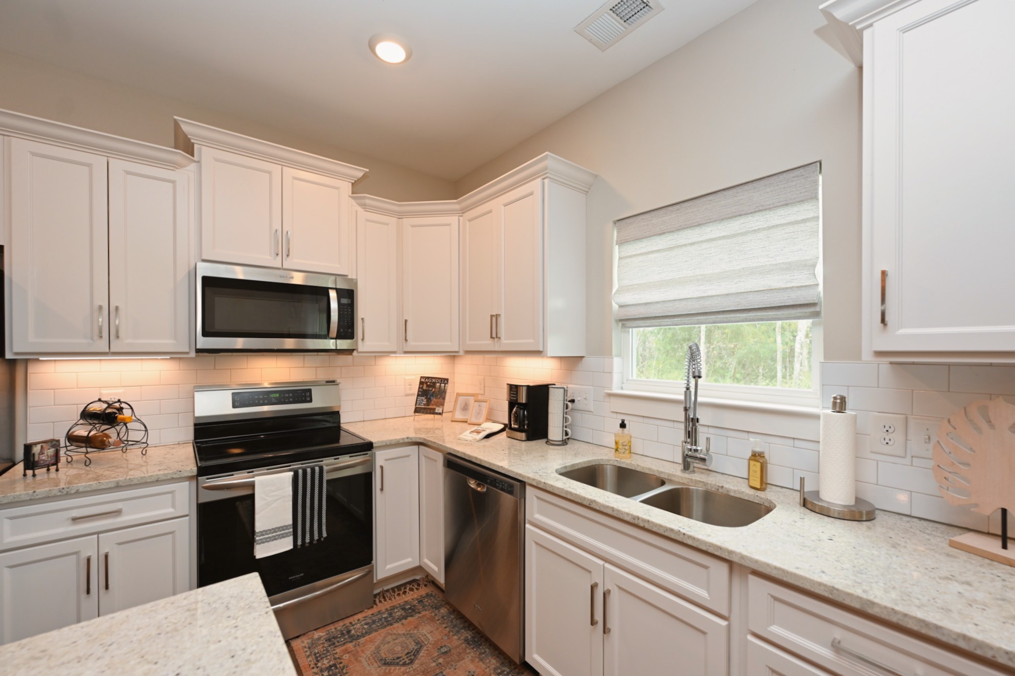 1144 Lock 4 Road, Unit J4 Gallatin, TN 37066 - Photo 10 of 39 a kitchen with a sink stove and microwave