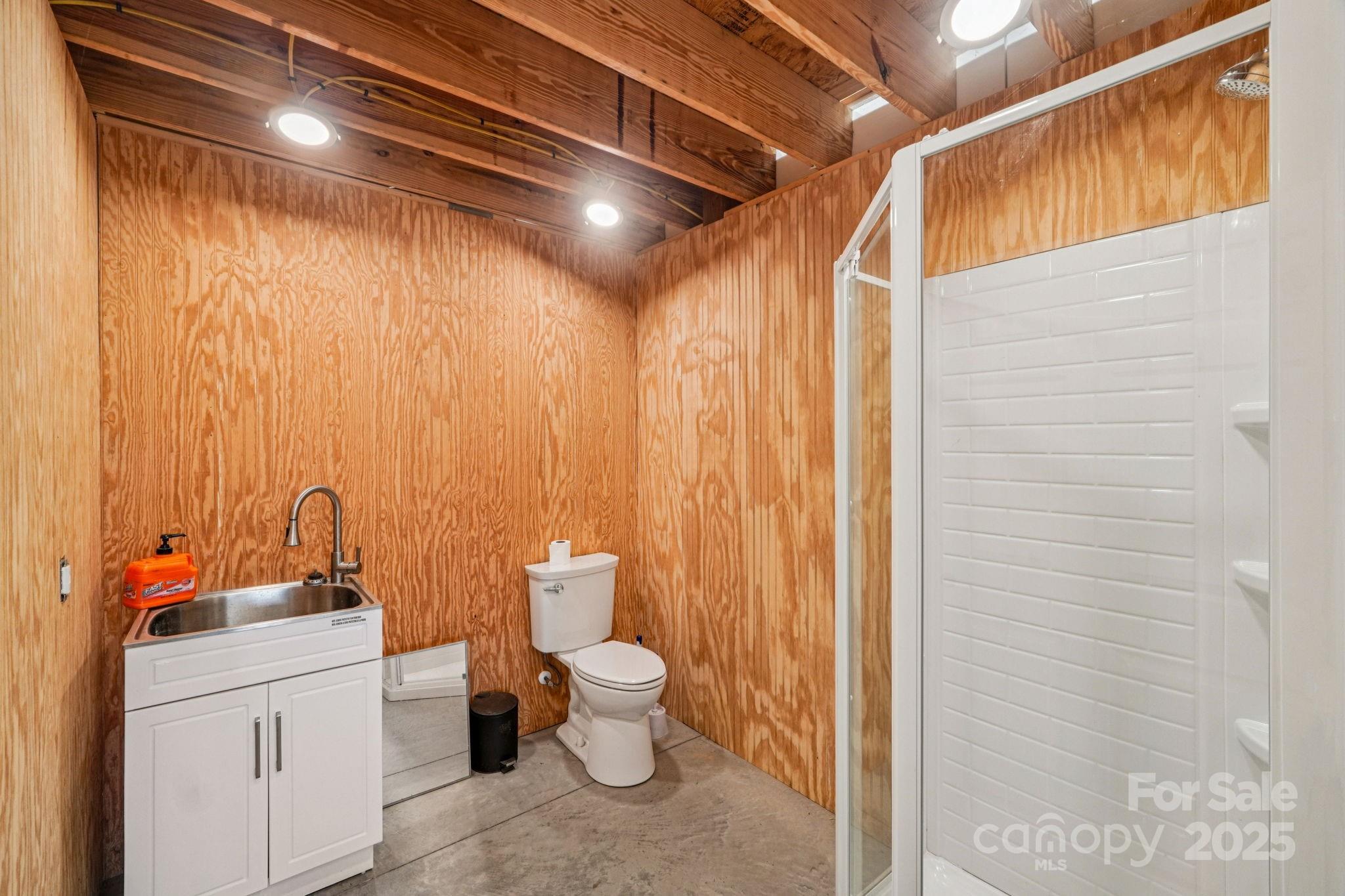 510 Lillys Bridge Road Mount Gilead, NC 27306 - Photo 14 of 18 a bathroom with a toilet a sink and shower