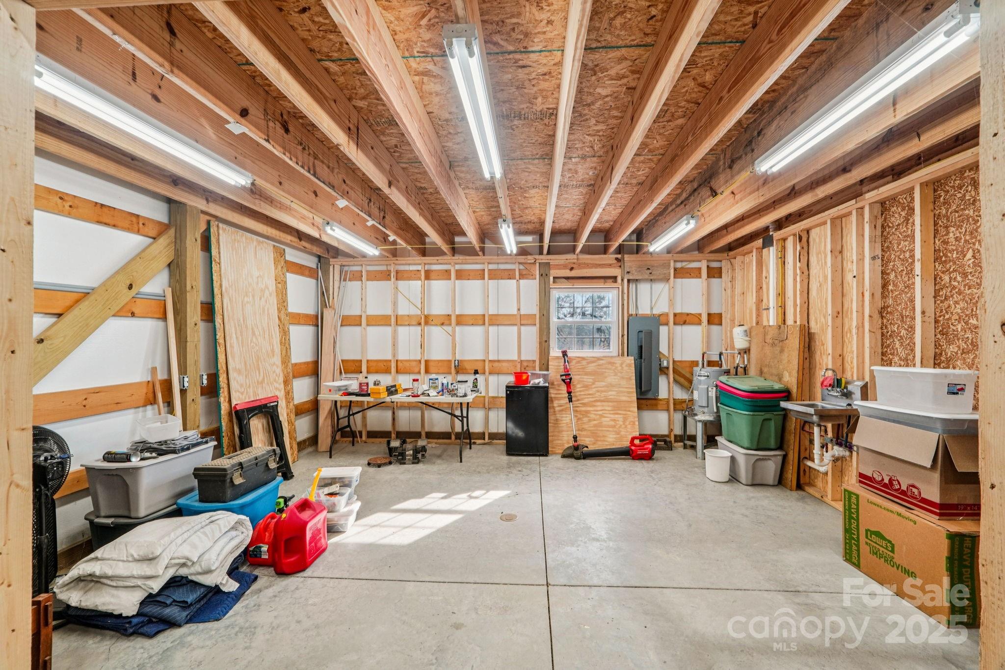510 Lillys Bridge Road Mount Gilead, NC 27306 - Photo 16 of 18 a living room with lots of furniture and a large window