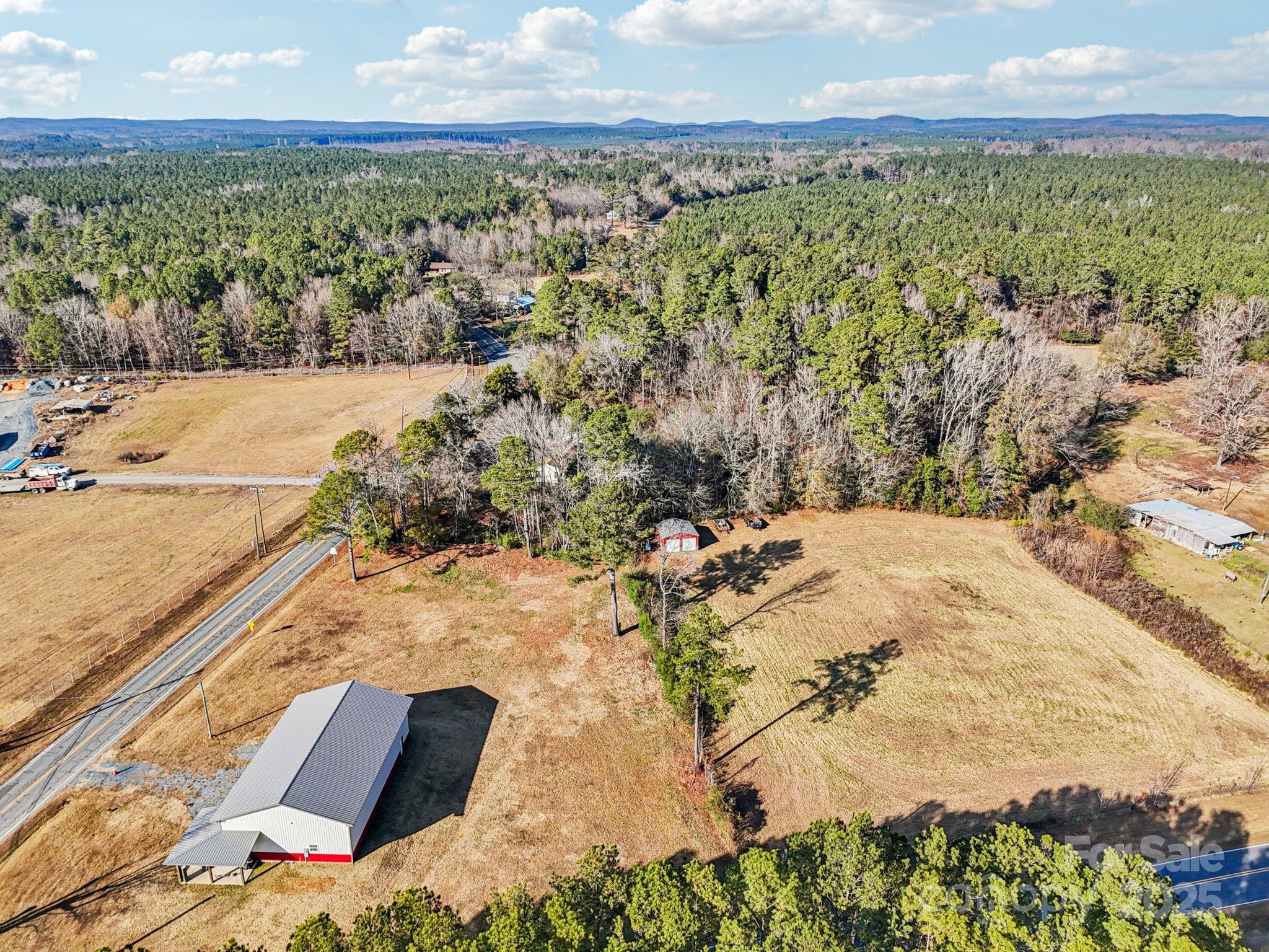 510 Lillys Bridge Road Mount Gilead, NC 27306 - Photo 2 of 18 a view of a lake with a mountain