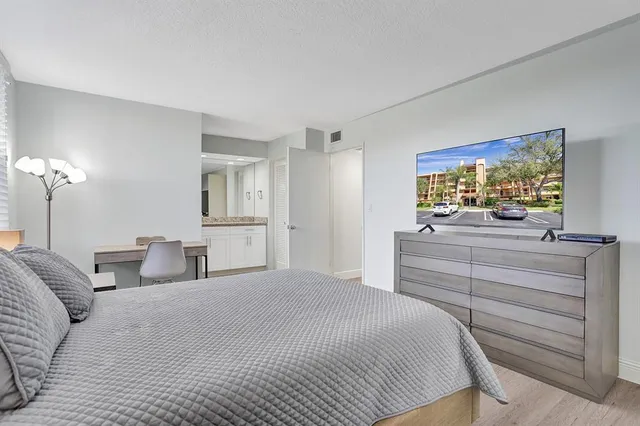 a bedroom with a bed and a dresser