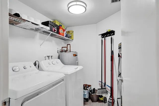 a utility room with dryer and washer