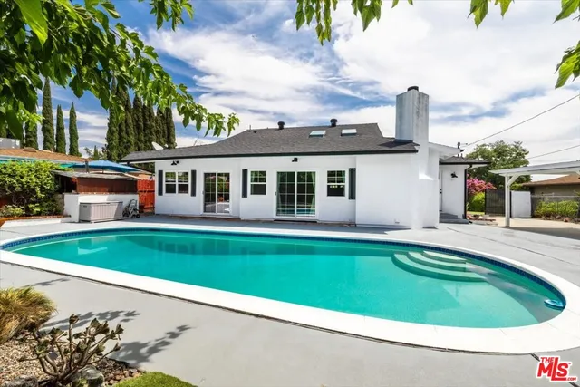 a view of a house with a swimming pool