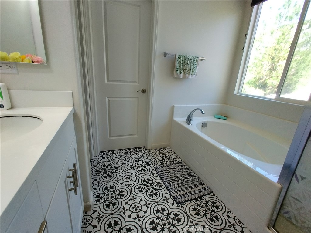 11811 Cramer Road Yucaipa, CA 92399 - Photo 25 of 56 a bathroom with a bathtub and a sink