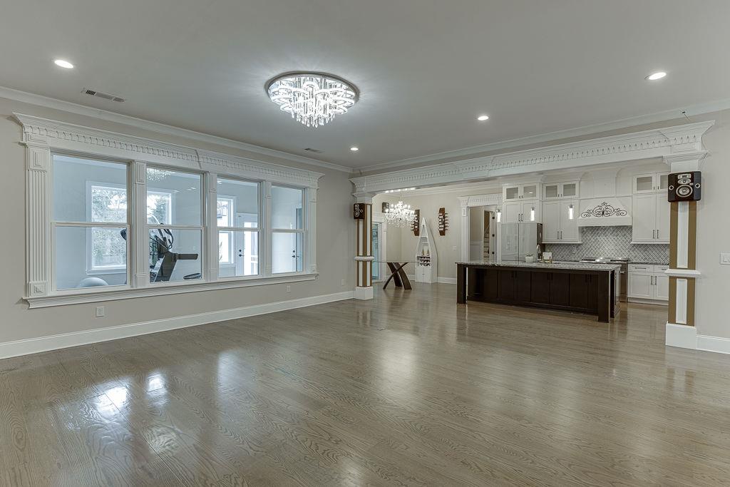 861 Bailey Woods Road Dacula, GA 30019 - Photo 14 of 67 a view of an empty room with kitchen and window