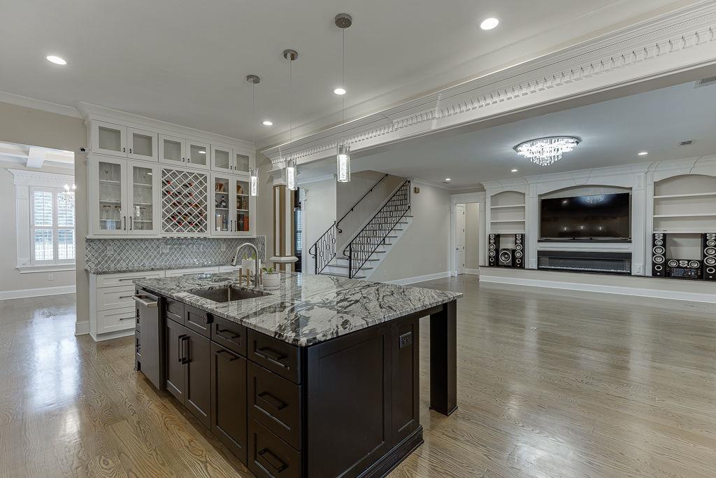 861 Bailey Woods Road Dacula, GA 30019 - Photo 18 of 67 a kitchen with a stove a sink and a refrigerator