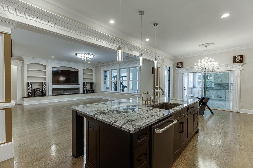 861 Bailey Woods Road Dacula, GA 30019 - Photo 19 of 67 a kitchen with granite countertop a stove and a sink