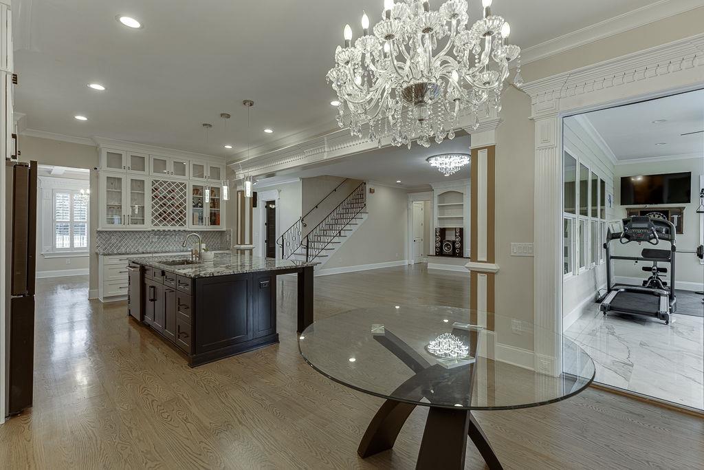 861 Bailey Woods Road Dacula, GA 30019 - Photo 20 of 67 a kitchen with stainless steel appliances granite countertop a refrigerator a sink a stove and a wooden floors