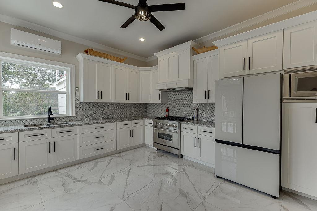 861 Bailey Woods Road Dacula, GA 30019 - Photo 21 of 67 a kitchen with granite countertop stainless steel appliances and white cabinets