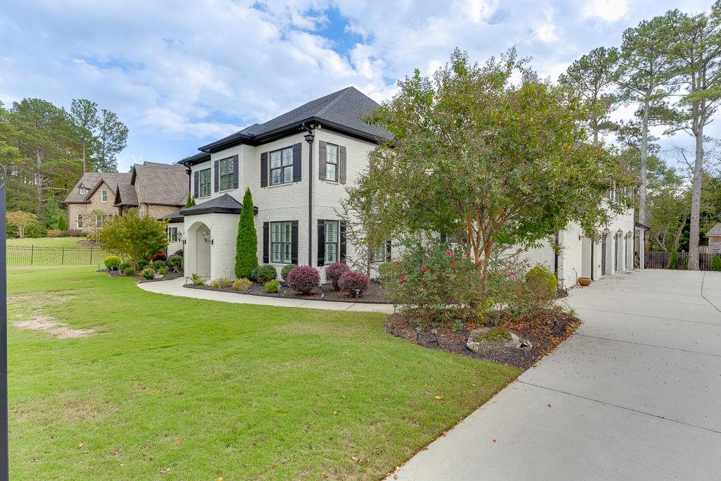861 Bailey Woods Road Dacula, GA 30019 - Photo 3 of 67 a view of a house with garden and a tree