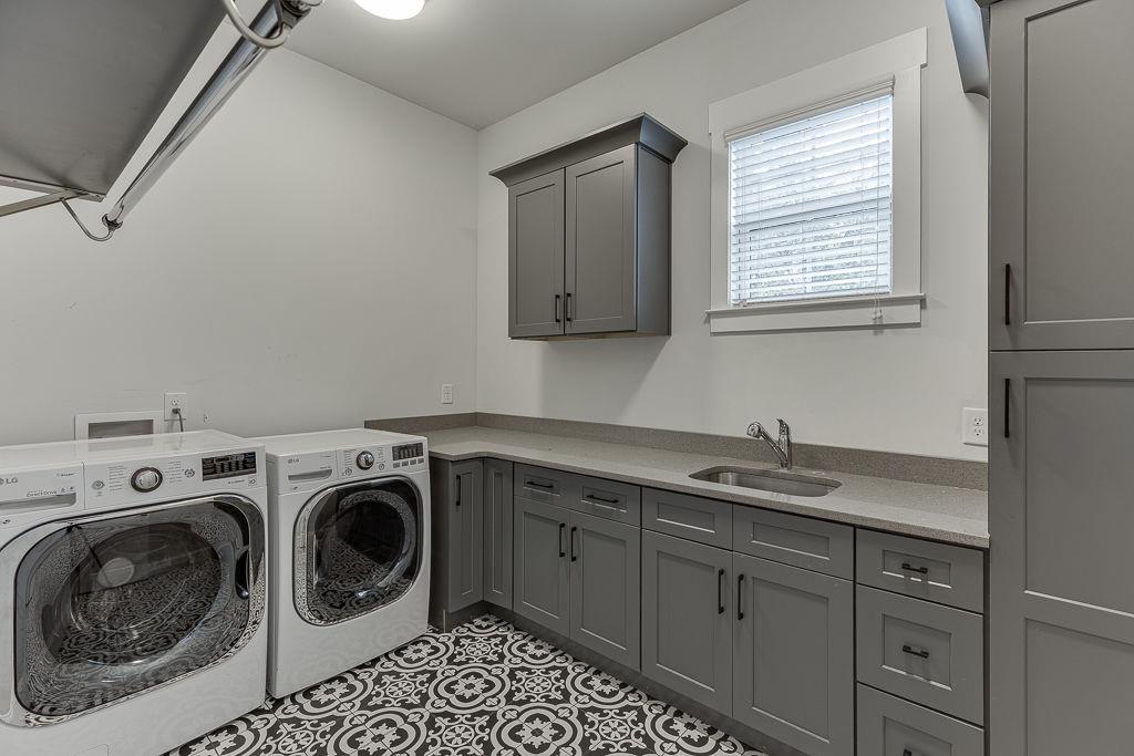 861 Bailey Woods Road Dacula, GA 30019 - Photo 32 of 67 a utility room with sink dryer and washer