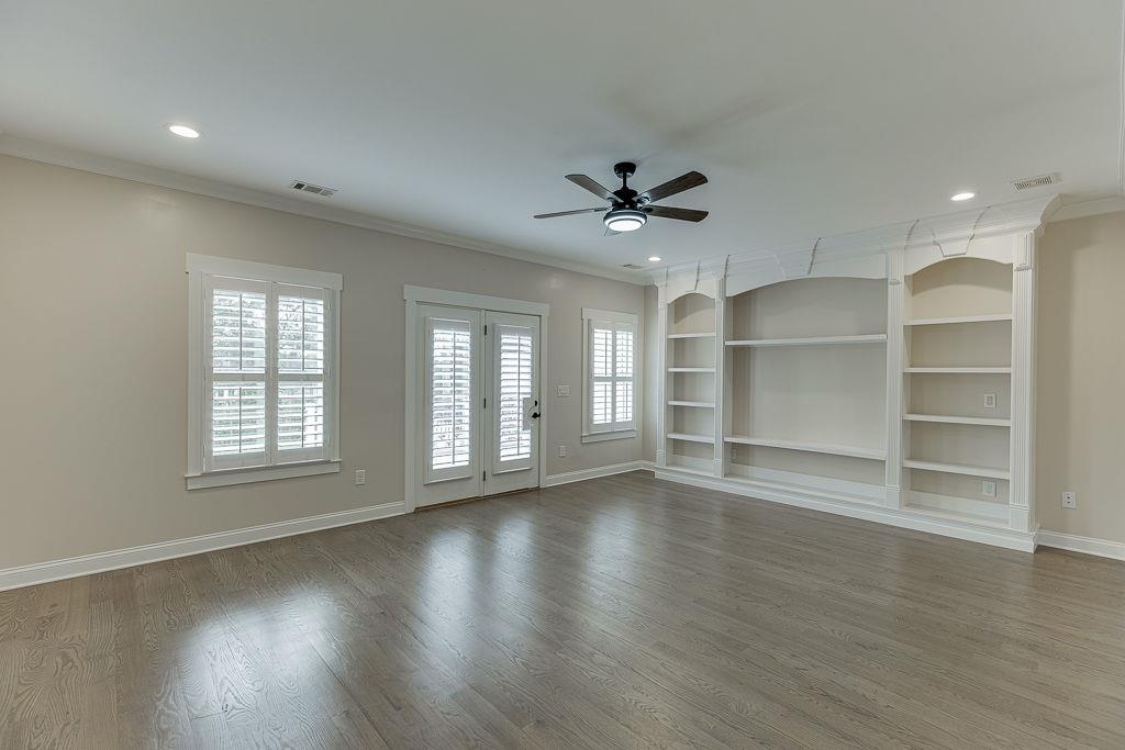 861 Bailey Woods Road Dacula, GA 30019 - Photo 36 of 67 a view of an empty room with a window and wooden floor
