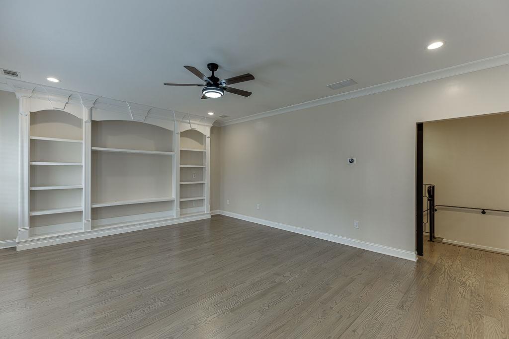 861 Bailey Woods Road Dacula, GA 30019 - Photo 37 of 67 a view of an empty room with a window and a ceiling fan