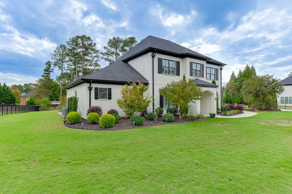 861 Bailey Woods Road Dacula, GA 30019 - Photo 4 of 67 a front view of house with yard and green space