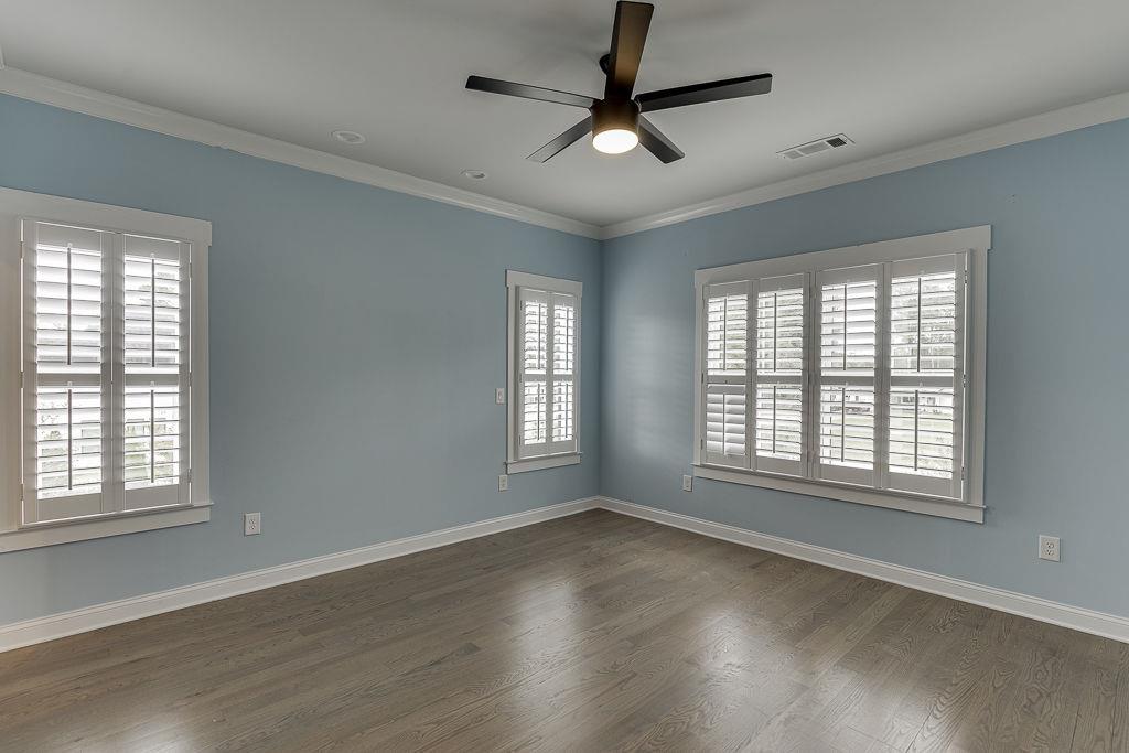861 Bailey Woods Road Dacula, GA 30019 - Photo 41 of 67 a view of an empty room with wooden floor and a window