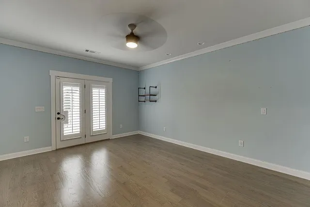 a bathroom with a granite countertop shower a sink and a toilet