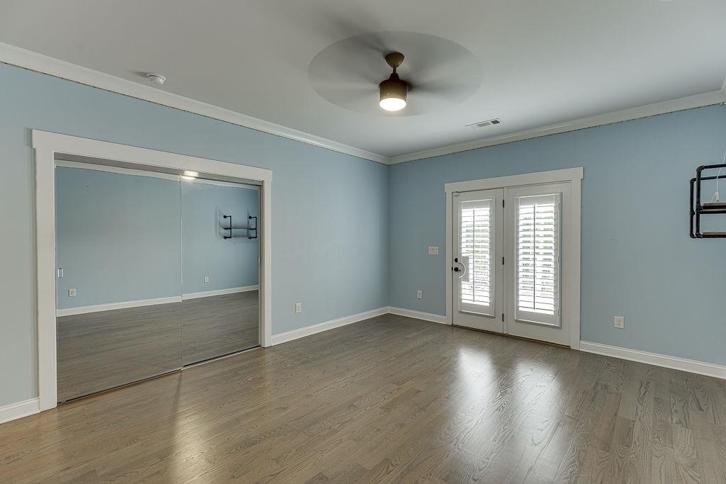 861 Bailey Woods Road Dacula, GA 30019 - Photo 45 of 67 an empty room with wooden floor and windows